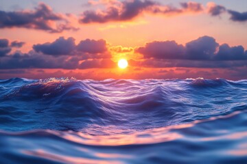 Obraz premium Breathtaking sunset reflections on the waves of the deep blue sea with vibrant clouds in the sky