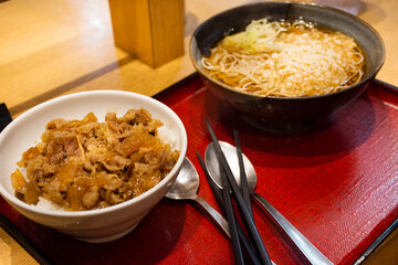 Japanese food set meat gyudon with rice or garlic fried rice recipe beef and ramen clear soup of local restaurant shop in Ariake train JR railway Station in Koto City, Tokyo, Japan