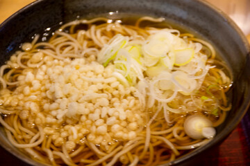 Japanese food Soybean fried top on ramen clear soup of local restaurant shop in Ariake train JR railway Station of Tokyo Bay in Koto City, Tokyo, Japan