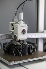 Modern 3D printer printing figure close-up