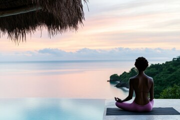 Serene morning meditation by infinity pool with ocean view at sunrise in tropical nature retreat