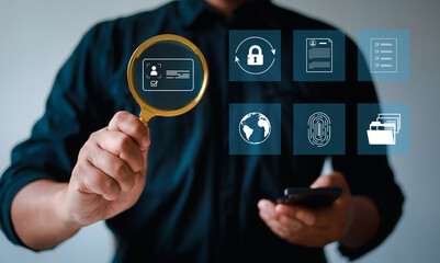 (KYC) Businessman holding magnifying glass and identity verification symbol to increase financial security and access personal financial information. Biometric security. Know your customer concept.
