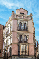 Fototapeta premium Facade of a building with two balconies and a Mudejar-style viewing point in a house in Toledo. Spain