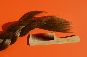 natural, long female hair, grooming, combing hair, hairstyle of a man, a girl. background for the design.