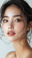 Naklejka premium Captivating portrait of an asian woman against a minimalist background