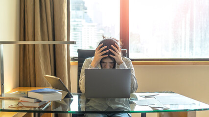 Panic attack working woman, stressful depressed student or businesswoman, burnout person with anxiety disorder mental health illness, headache and migraine, sitting in front of laptop computer desk