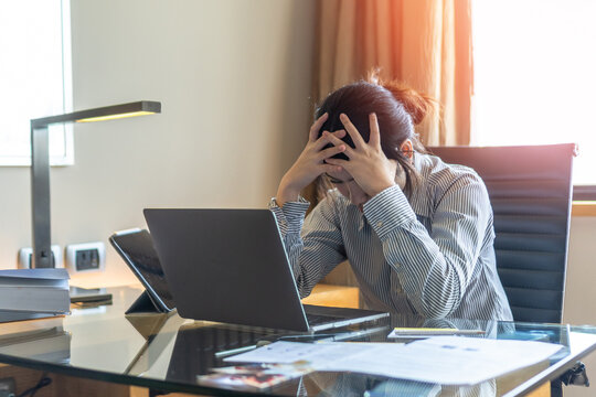 Panic attack working woman, stressful depressed student or businesswoman, burnout person with anxiety disorder mental health illness, headache and migraine, sitting in front of laptop computer desk