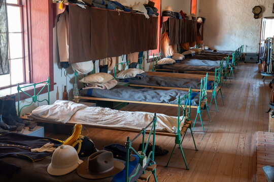 ​Antique military quartermaster style cast iron freestanding end beds lined the long wall of the building, Enlisted Men Barrack, Fort Davis National Park, Texas