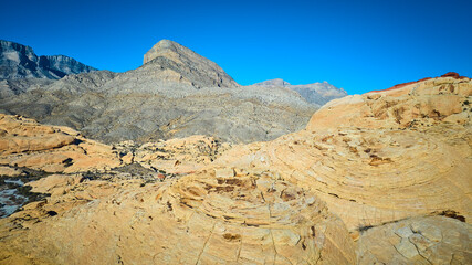 Aerial of Red Rock Formations and Mountains in Nevada Desert