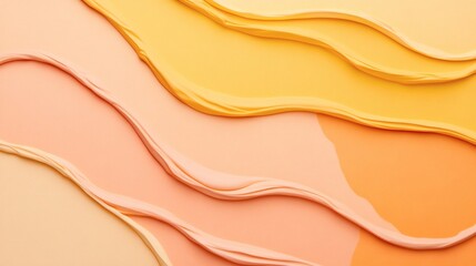 Colorful layers of creamy texture in shades of peach and yellow arranged in a flowing pattern on a smooth surface