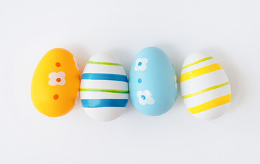 A festive Easter flat lay with colorful eggs, perfect for holiday greetings, decorations, and seasonal designs.