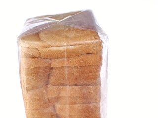 Close up of bland bread packed in transparent plastic container isolated on white background