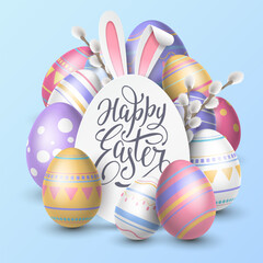 Festive card with an egg-shaped paper banner surrounded by realistic willow sprigs, paper cutout bunny ears and painted patterned 3D eggs on a blue background. Holiday card with Happy Easter lettering