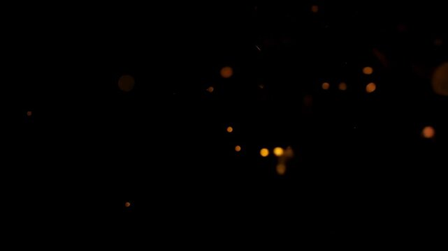 Bright ember sparks flicker in the darkness, adding warmth and dynamic energy.