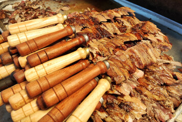 Delicious grilled meat barbecue shish kebab on a skewer, cooked on the grill	