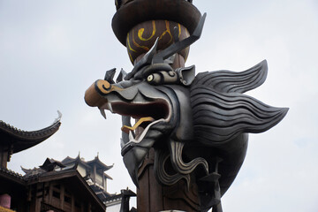 Art symbol sculpture carving chinese dragon statue on pole for chinese people foreign travelers...