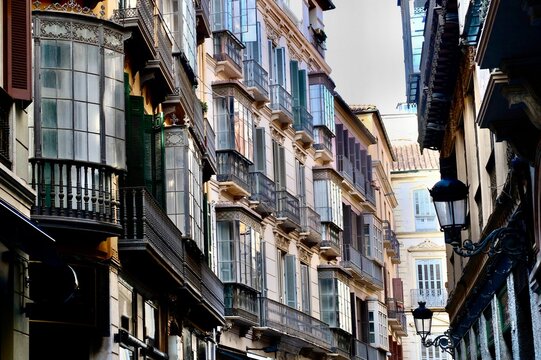 Typical houses with their partly glazed balconies in the old town of M&aacute;laga, Andalusia, Spain