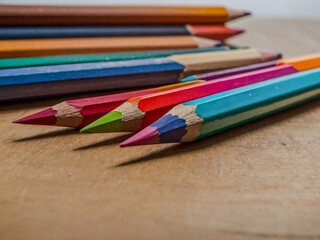 Fototapeta premium Colorful pencils in an art studio bathed in natural light.