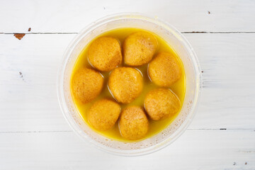 top view golden curry flavor fish balls