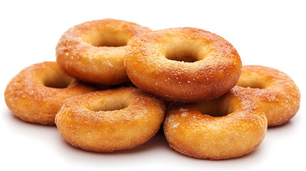 Golden brown sugar coated bagels stacked in pile, showcasing their soft texture and slightly crispy exterior. sugar granules add delightful sweetness to freshly baked dough