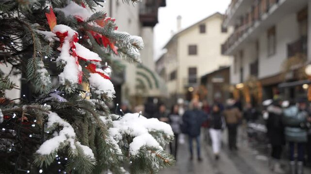 View of Christmas tree on Via Roma and in Piazza Abbe Henry in Courmayeur, Aosta Valley, Italian Alps, Italy