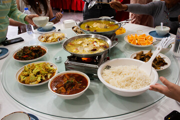 Traditional chinese food gourmet meal set or local cuisine meal cultural tribe food on table for serve customers people travelers taste eat and tasty drink in restaurant at Zhangjiajie in Hunan, China