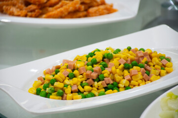 Traditional chinese food gourmet or local cuisine meal Stir-fried salad green peas and sweet corn with pork ham for travelers customers use taste eat and tasty drink at Yichang city in Hubei, China