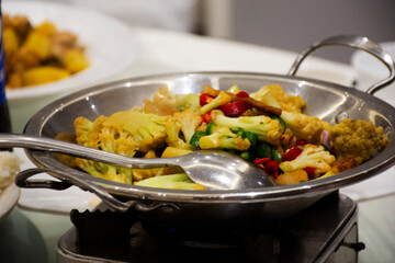 Traditional chinese food gourmet meal or local cuisine cultural tribe Stir-fried cauliflower with pepper and chili paste sauce served customer people taste eat tasty drink at restaurant in Hunan China