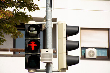 Red traffic lights signals on Sandhausen street at Heidelberg-Kirchheim village in Heidelberg,...