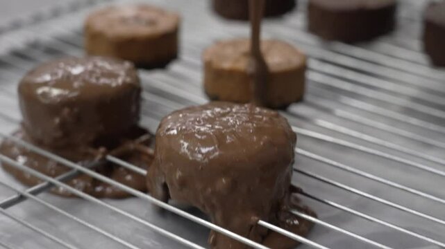 Chocolate-coated cookies in a pastry factory