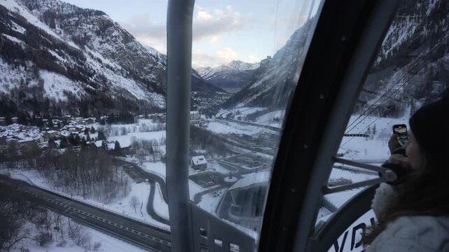 Onboard view of Skyway Monte Bianco cable car from Pavillon and peaks on Italian French border at sunset, Courmayeur, Aosta Valley, Italian Alps, Italy