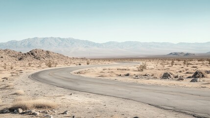 Scenic Curved Road Through Barren Desert Landscape in Soft Natural Light