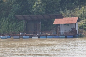wooden house in the river