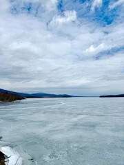 Stunning frozen Ashokan Reservoir near Kingston NY in Ulster County. Near Catskill Mountains.  Winter ice covered water, blue green color.  Gorgeous for fishing, Aurora Borealis and star gazing  