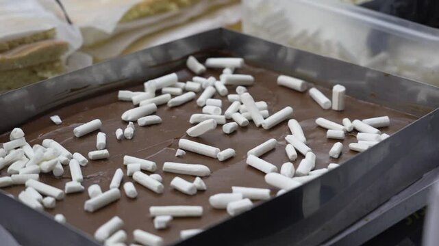 Meringue cake decoration in a pastry factory