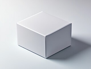 Naklejka premium Simple white cube resting on a surface casting a soft shadow