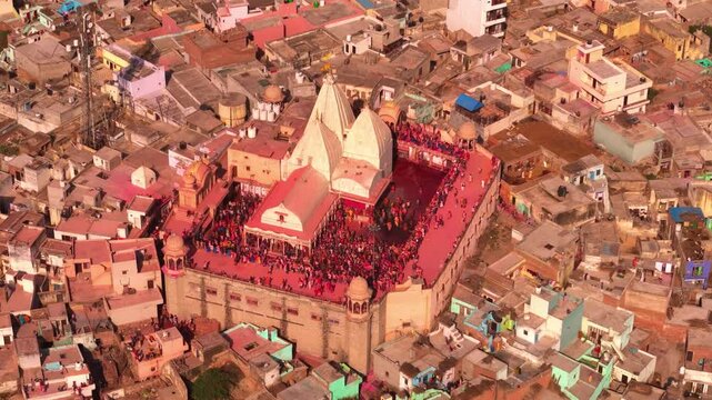 Close-up aerial shot of Holi festival in Barsana, temple covered in gulal