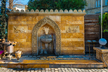 Public drinking fountain with a good stone wall design