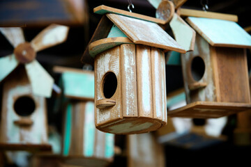 Rustic Wooden Birdhouses Hanging in a Decorative Arrangement