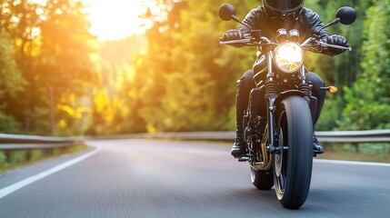 Naklejka premium Motorcyclist in Black Gear Riding on Country Road with Beautiful Sunlight and Lush Green Background : Generative AI