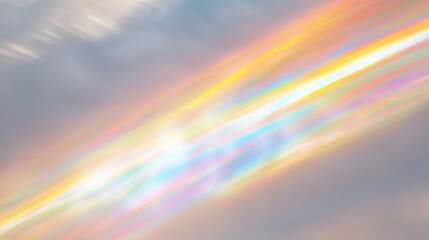 Beautiful rainbow light refraction on a white background with vibrant rainbow light streaks on a grey wall. Iridescent light beams creating a colorful glow and spectrum effects through prism lighting.