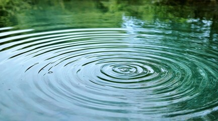 Captivating ripples form serene water rings.