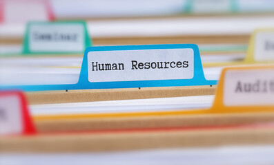 File folders with a tab labeled Human Resources