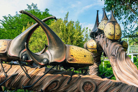 Close up to colorful and patterns of insects or bug model surfaces created with cement. Beautiful colorful and surrealistic sculptures or statues of insects or bugs decoration in garden.