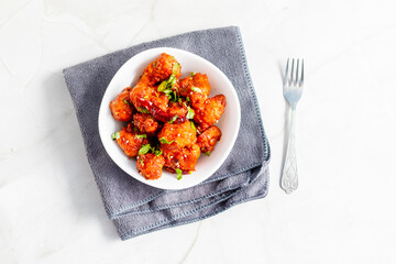 Gobi Manchurian is a crispy, spicy Indo-Chinese dish made with battered, fried cauliflower tossed in a tangy, flavorful soy-garlic sauce.
