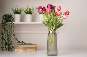 Morning spring still life with bouquet of fresh tulips on table. Interior design.