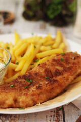 Fish and chips served on the plate, traditional dish of Great Britain