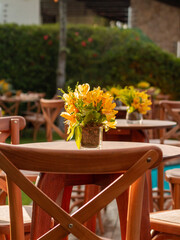 Wooden table with yellow flowers