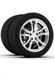 Fototapeta premium Shiny alloy rims and black tires on white background.
