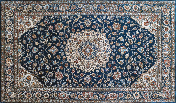 Traditional oriental rug with intricate floral pattern in blue beige brown